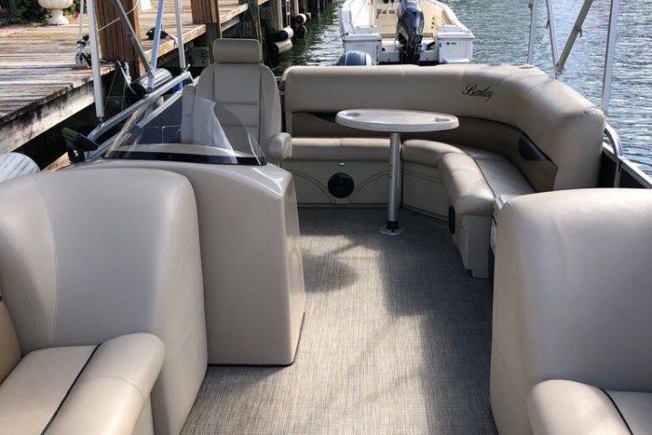 a boat sitting on top of a car