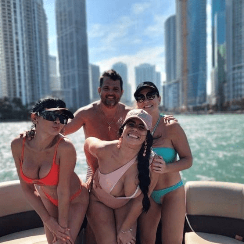 a group of people sitting at a beach